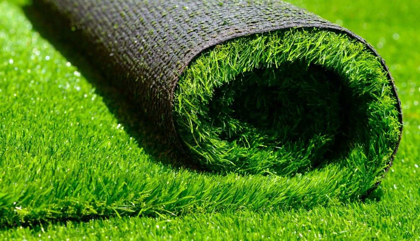 Close-up view of premium artificial grass roll showing realistic texture